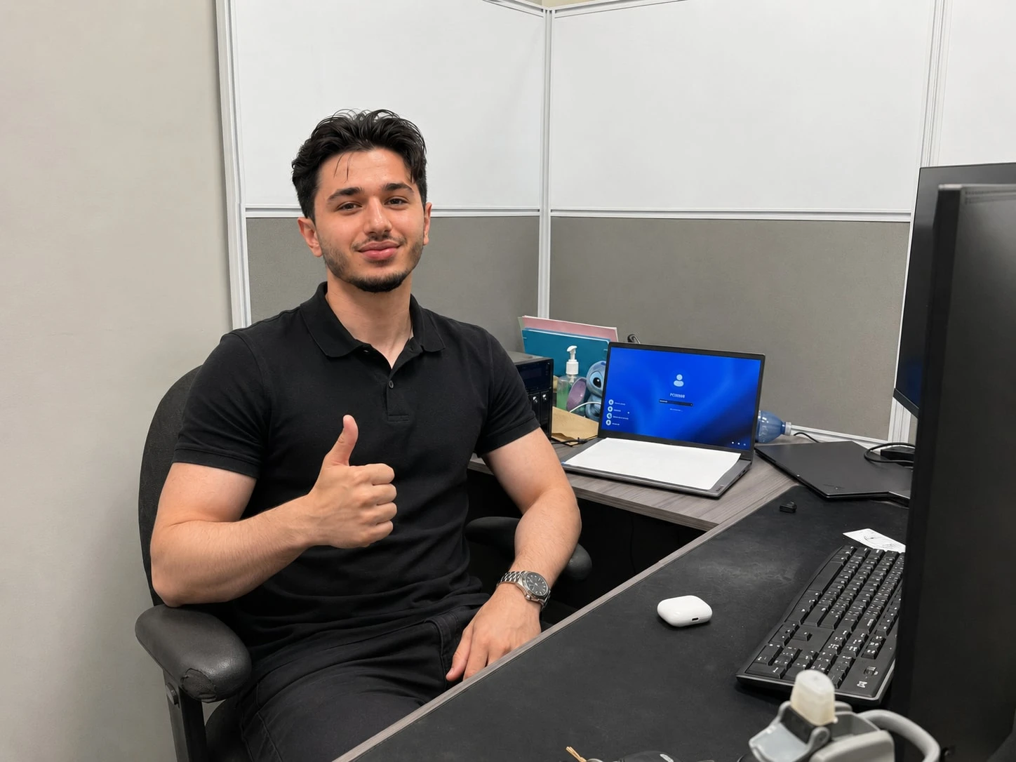 Usama Kelani working at his desk