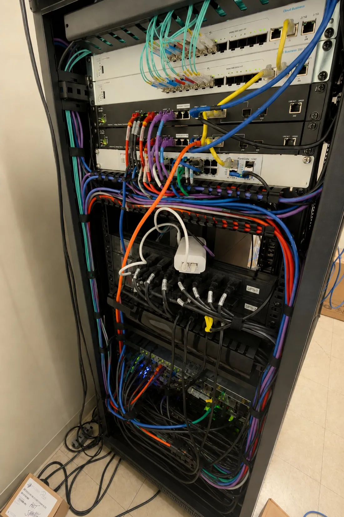 Network cabinet with patch panel and cable runs at Techspan